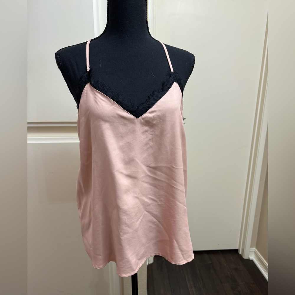 Pink top with black lace detail. Size medium